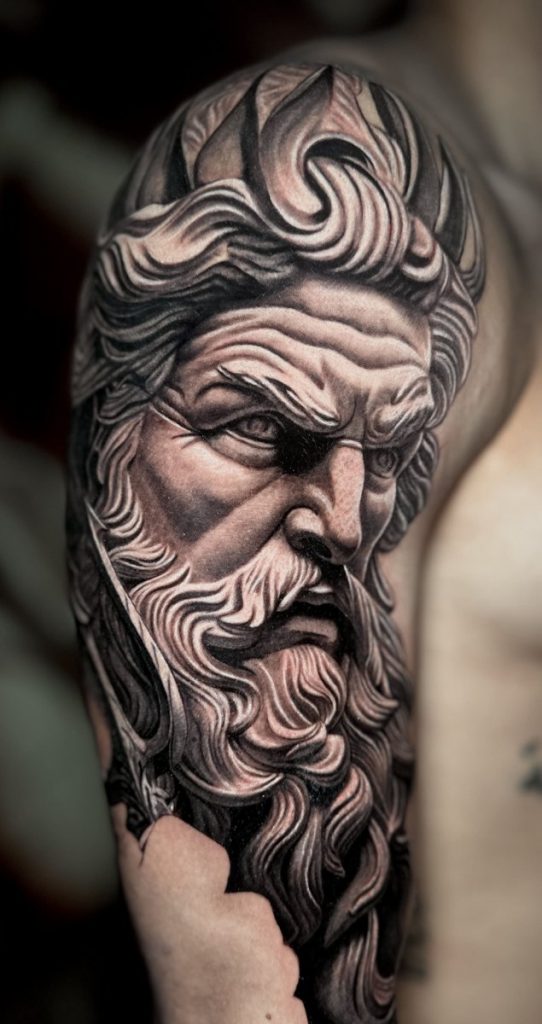 Close-up detail of a Black & Grey realism tattoo showing smooth shading and contrast.