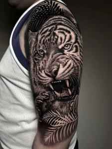 Black and grey realism tattoo artwork by Juanjo Art Tattoo, a Madrid-based tattoo artist.