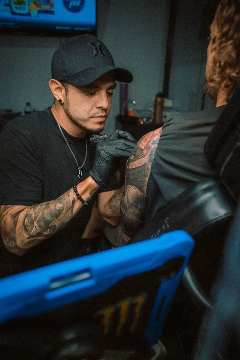 Juanjo Art Tattoo working on a black and grey realism tattoo session in Madrid