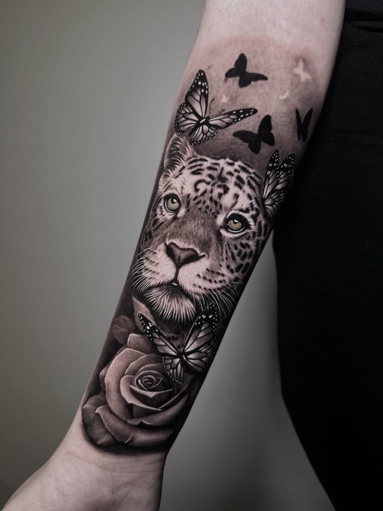 Custom Black and Grey tattoo designed for body anatomy